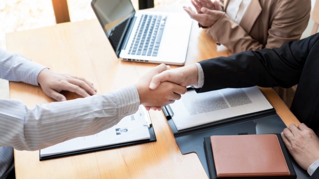 businessman employee candidate shaking hands with company leader HR manager or boss in office after